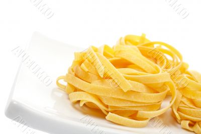 Uncooked pasta nest on a dish