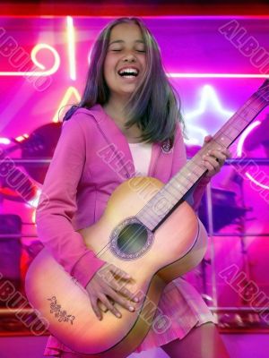 Happy teen girl with guitar