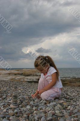 Girl on cloudy coast