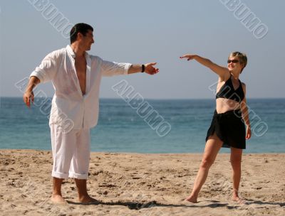 Couple dancing on the beach