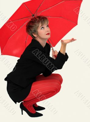 Businesswoman with a red umbrella