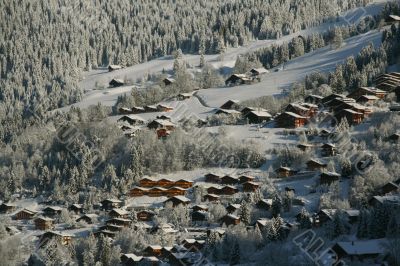 New snow on chalets in village New snow on chalets in village