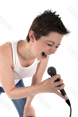 Woman singing into a microphone