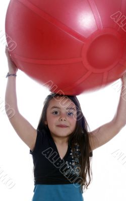Young girl with an exercises ball
