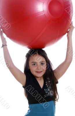 Young girl with an exercises ball