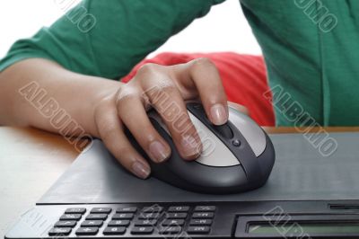 Girls hand on computer mouse Girls hand on computer mouse