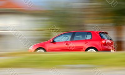 Fast moving red car