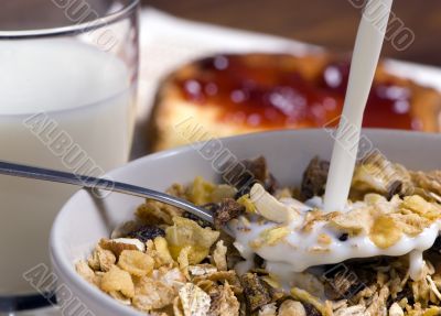 Morning Cereal pouring the milk Morning Cereal pouring the milk