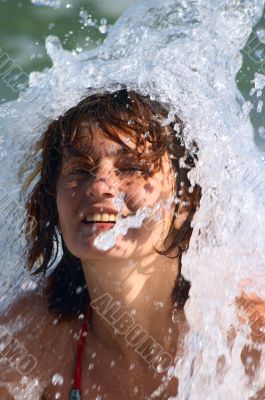 girl under the sea wave