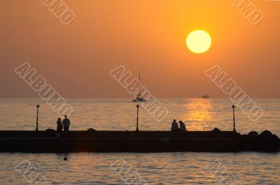 romantic couples on a pier