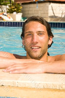 young man in the swimmingpool young man in the swimmingpool