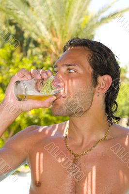 Young man drinking beer