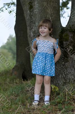 Cheerful little girl in the woods