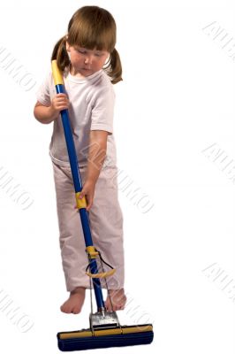 Upset little girl with mop