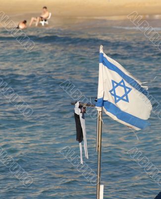 Israel state flag on a beach