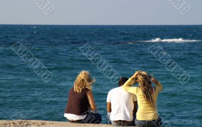 Happy friends on a sea shore Happy friends on a sea shore