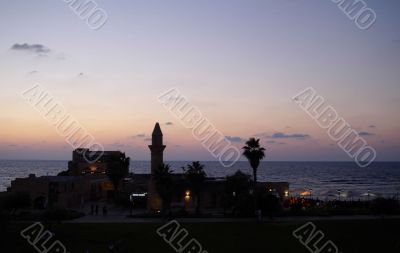old minaret in a sunset sea old minaret in a sunset sea