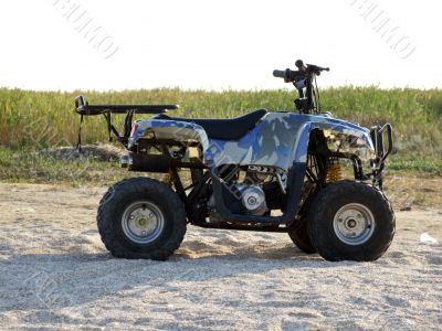 Small All Terrain Vehicle on a beach