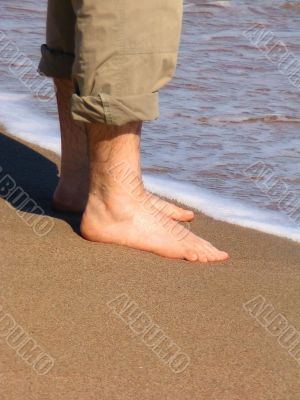 Man barefood on the beach