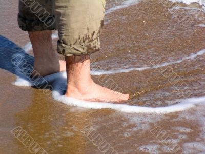 Man barefood on the beach