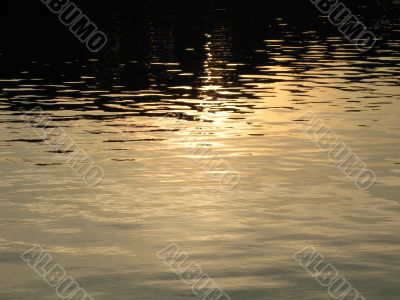 reflection of sun on the water waste