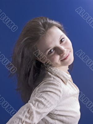 smiling woman on a blue smiling woman on a blue