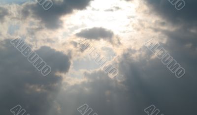 sunlight rays shining through the sky