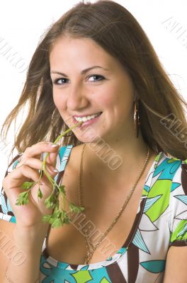 Portrait of the  girl with a stalk of a parsley