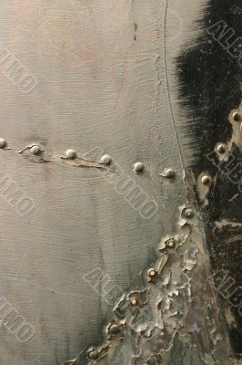 Rivets and layers of paint