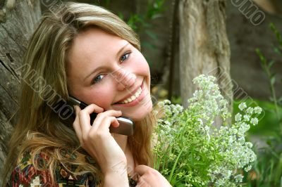 The beautiful rural girl with the mobile telephone