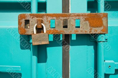 Rusted padlock on freight container closeup