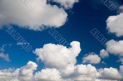 Cloudscape. White clouds in the blue sky.