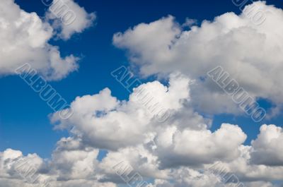 Cloudscape. White clouds in the blue sky.