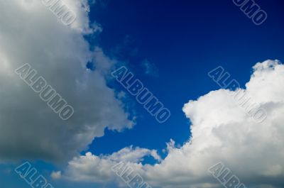 big white fluffy clouds in a deep blue sky