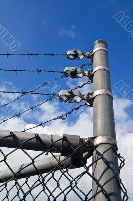 chain link fence with barbed wire on top