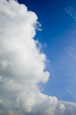 huge cumulus cloud in a bright blue sky