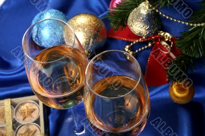 Glass of white wine on a beautiful christmas background