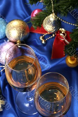 Glass of white wine on a beautiful christmas background