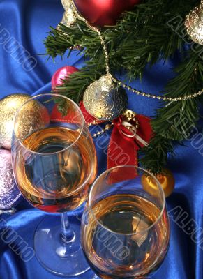 Glass of white wine on a beautiful christmas background