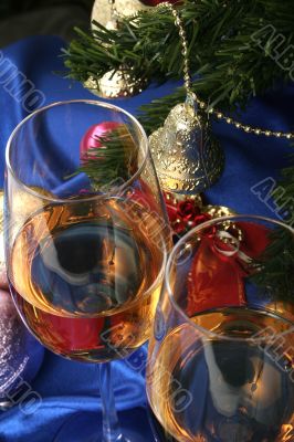 Glass of white wine on a beautiful christmas background