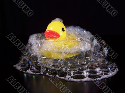 Yellow Rubber Duck In A Small Bubble Bath