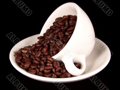 Cup Of Coffee Beans On Saucer