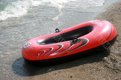 Red boat and seacoast