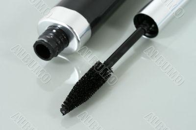 Mascara brush and bottle