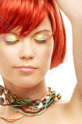 green beads redhead with eyes closed