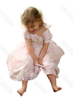 Small girl in pink gown on white background.