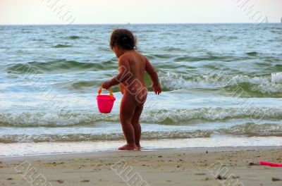 child playing on the beach