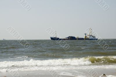 Cargo-boat near the coast