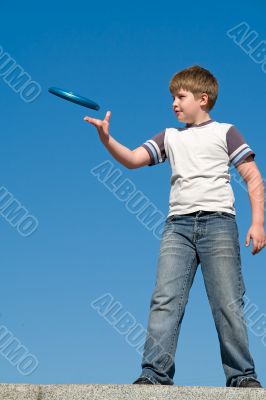boy playing frisbee boy playing frisbee