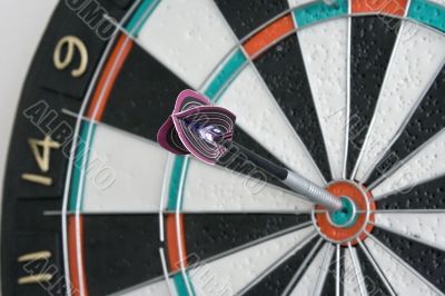 One dart in centre of the dartboard